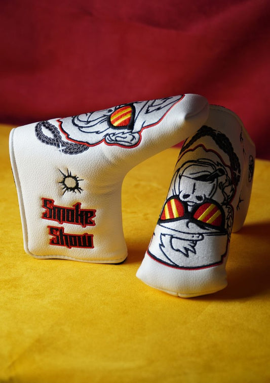 White golf club head cover with graphics and text on a yellow and red background