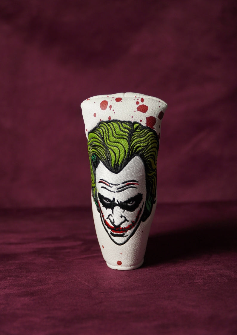 Blade headcover with a Joker design on a maroon background