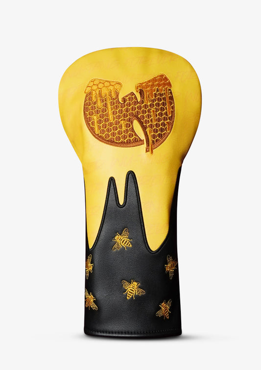 A golf club headcover featuring a yellow and black dripping design inspired by the Wu-Tang Clan logo, decorated with gold honeycomb patterns, a large honeycomb 'W' on the yellow section, and gold bees on the black section.