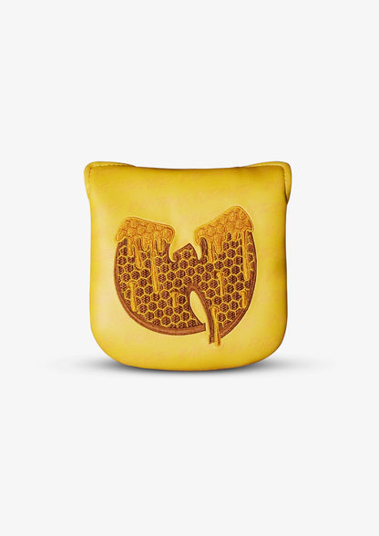 A yellow golf mallet headcover featuring an embossed honeycomb-style Wu-Tang Clan 'W' logo on the front, set against a plain light gray background.
